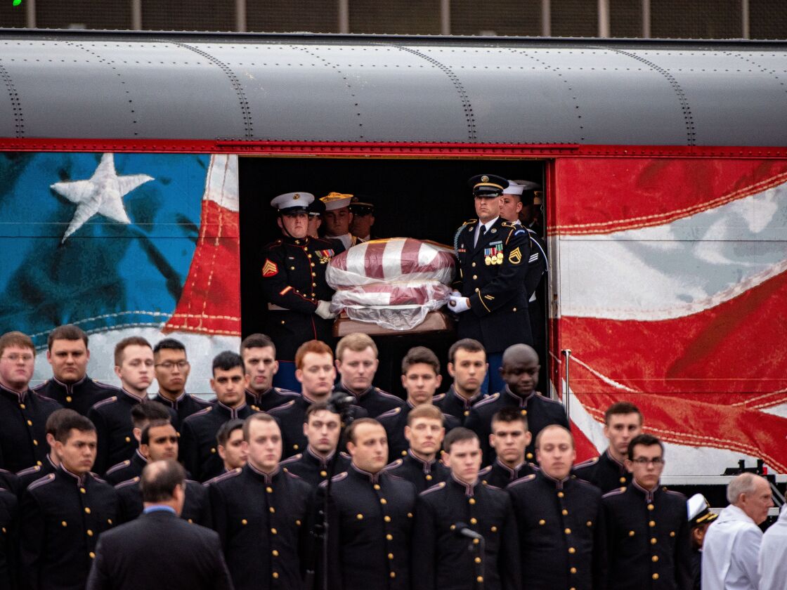 Pallbearers carry the casket of former President George H.W. Bush off of Pacific Union’s “Bush 4141” on Dec. 6, 2018 in College Station, Texas. The 41st president will be laid to rest near his presidential library next to his wife Barbara and daughter Rob